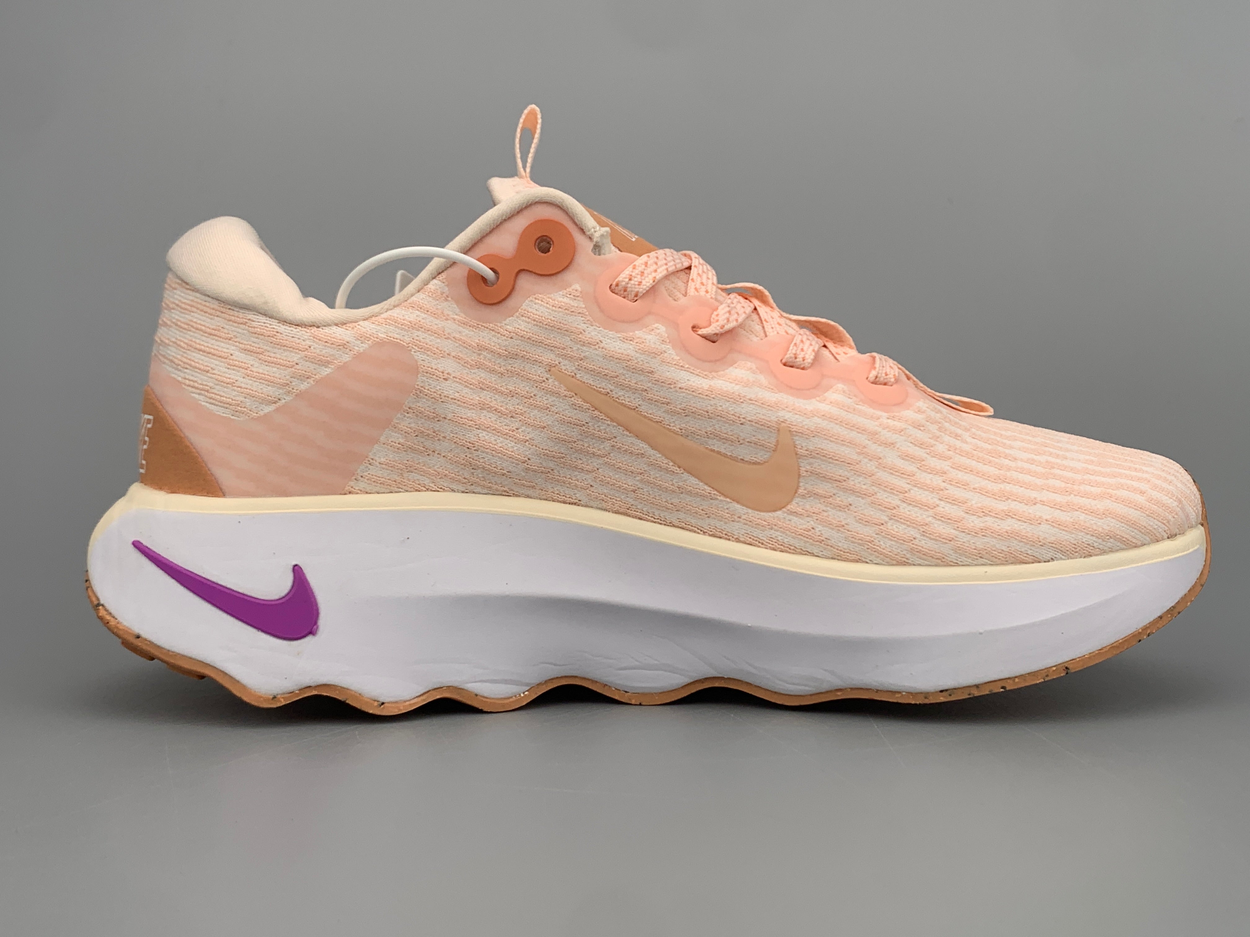 Nike motivia light pink shoes