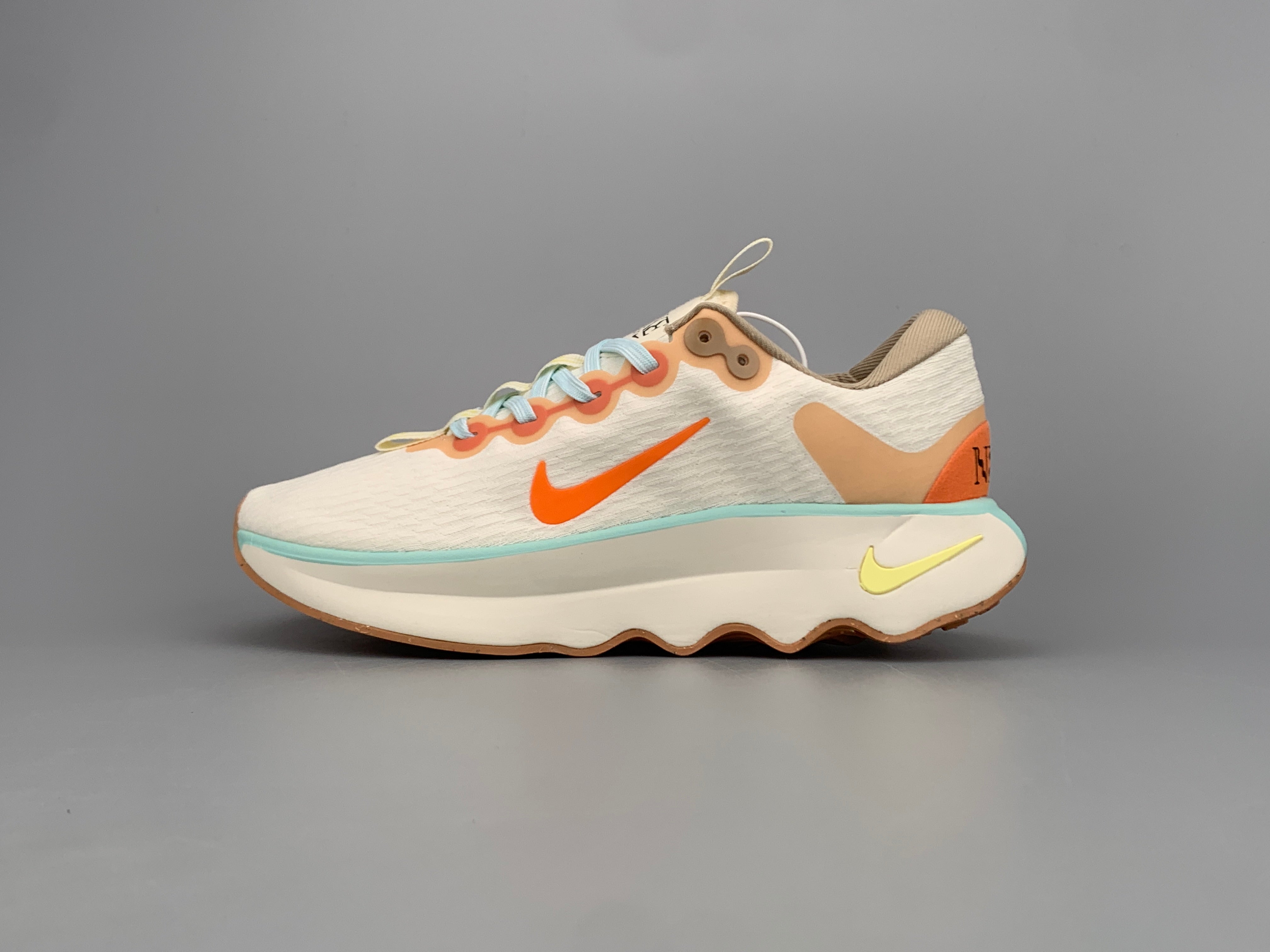 Nike motivia beige and pink shoes