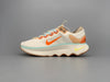 Nike motivia beige and pink shoes