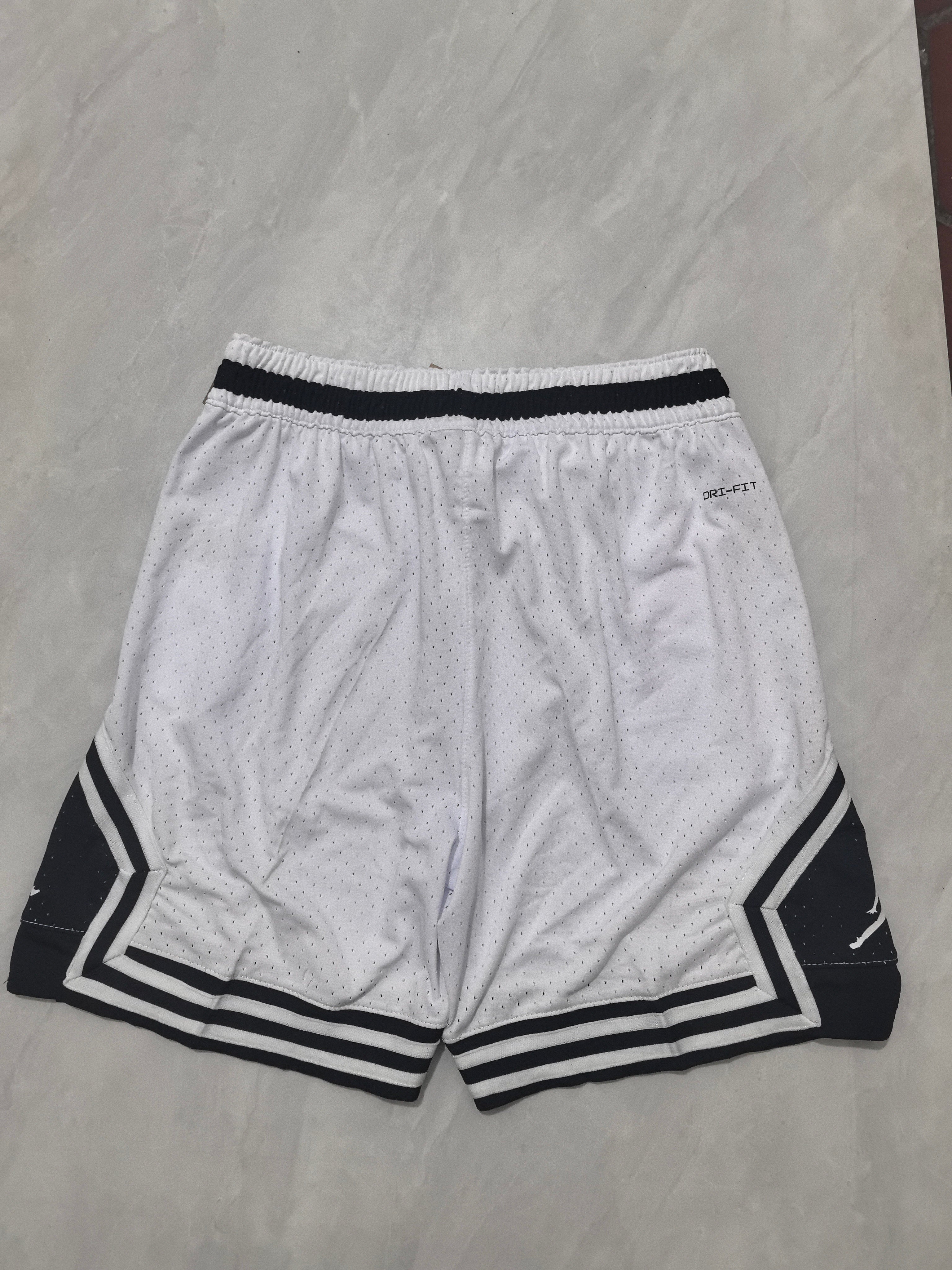 Jordan A-4 white shorts with black cleats