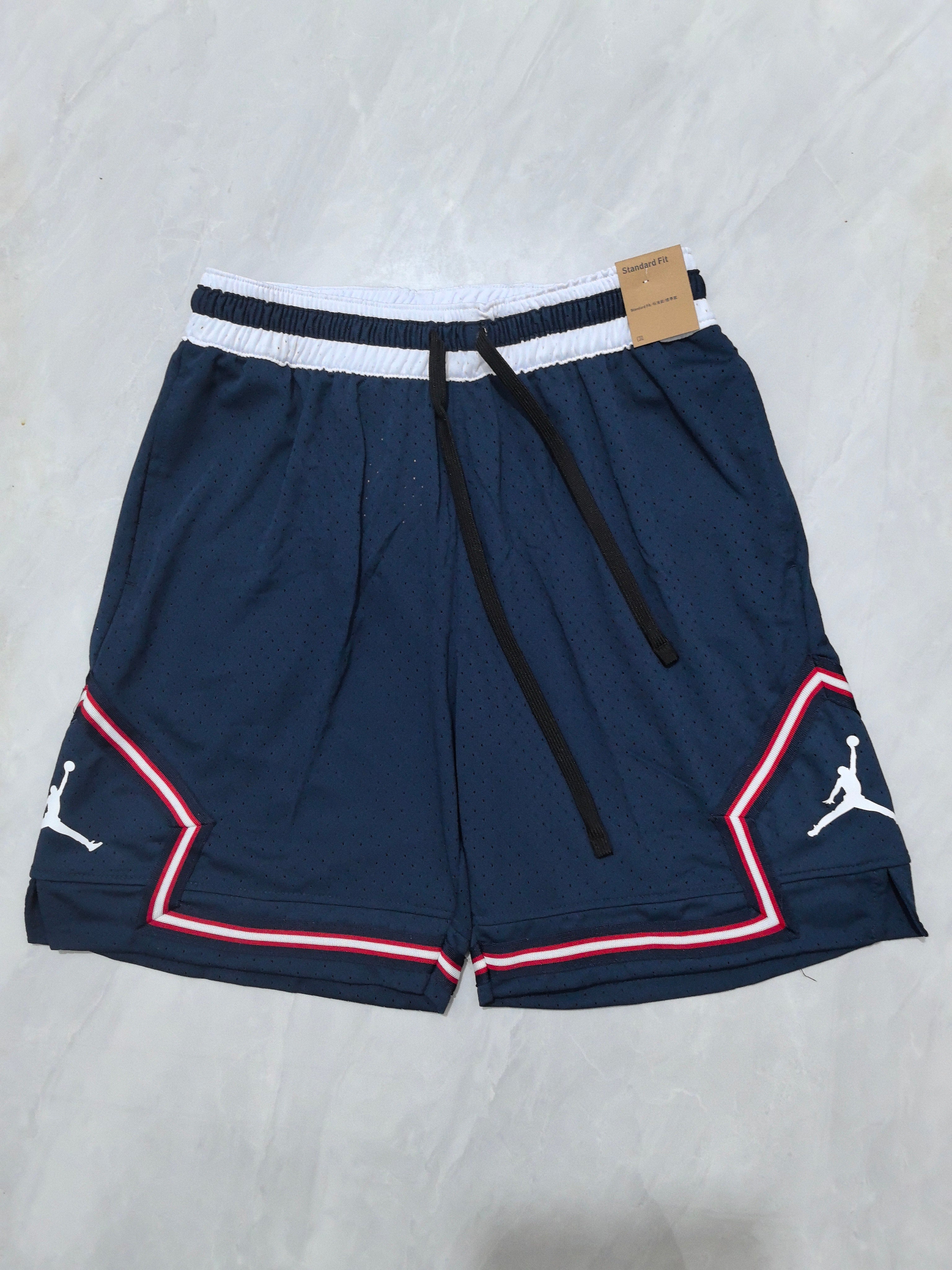 Jordan A-22 blue, white and red striped basketball shorts