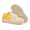 Nike SB beige and yellow shoes