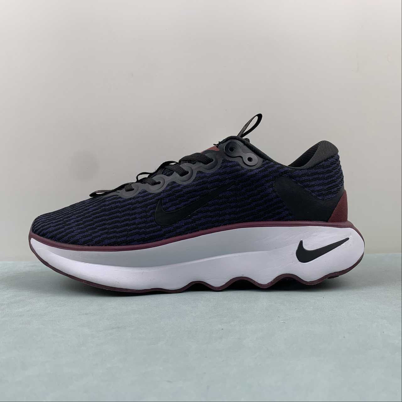 Nike motivia navy and brown shoes