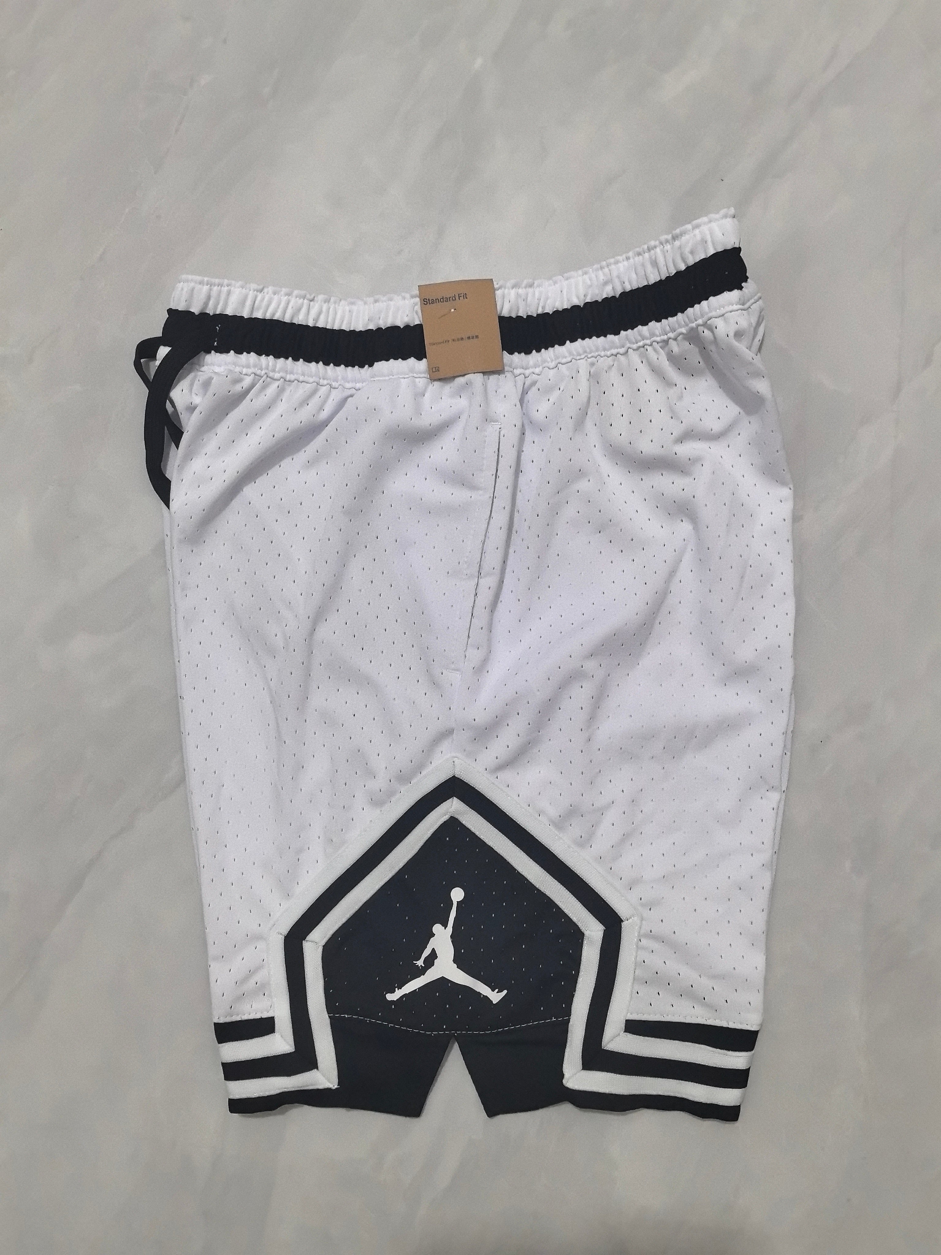 Jordan A-4 white shorts with black cleats