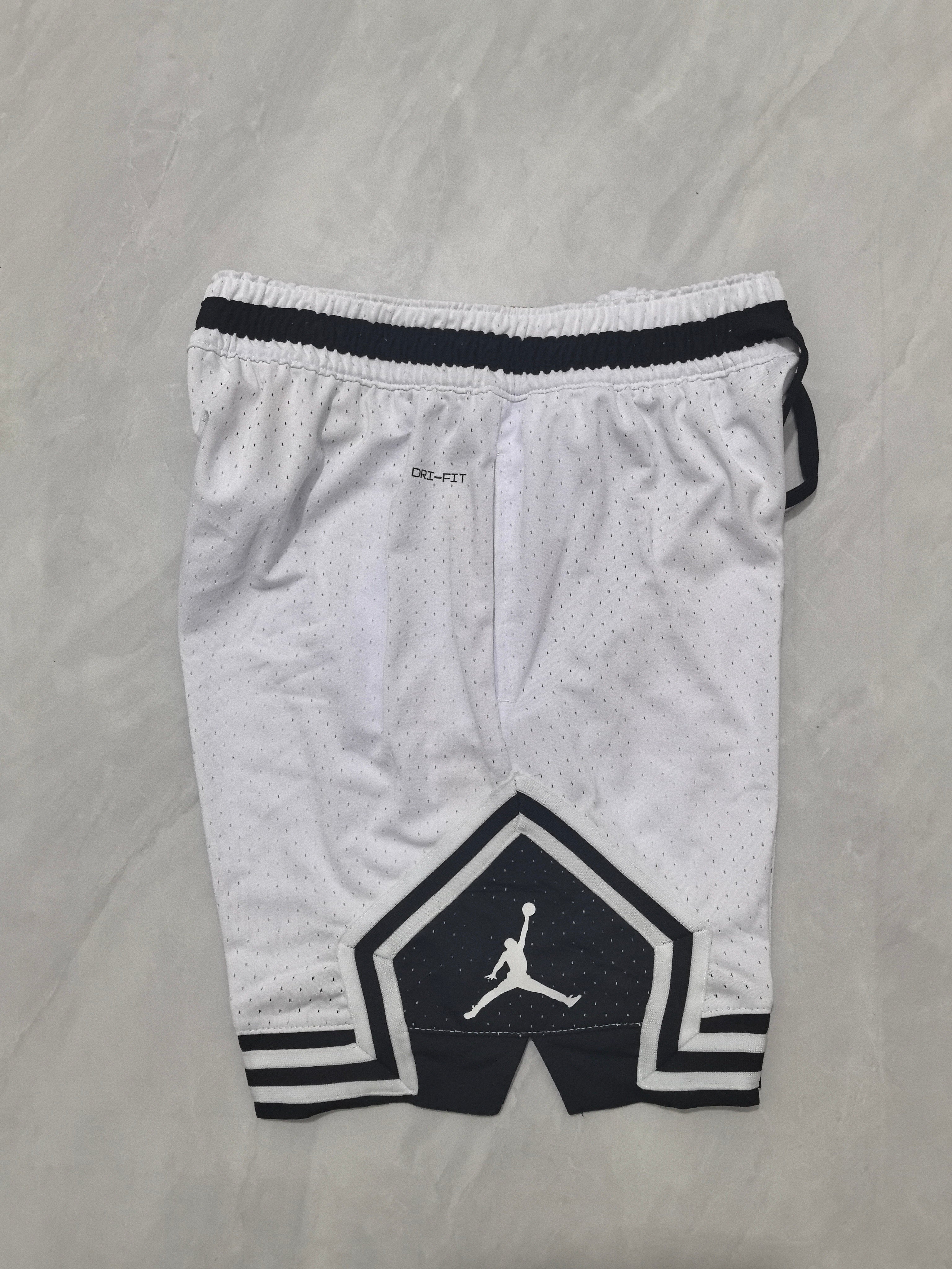 Jordan A-4 white shorts with black cleats